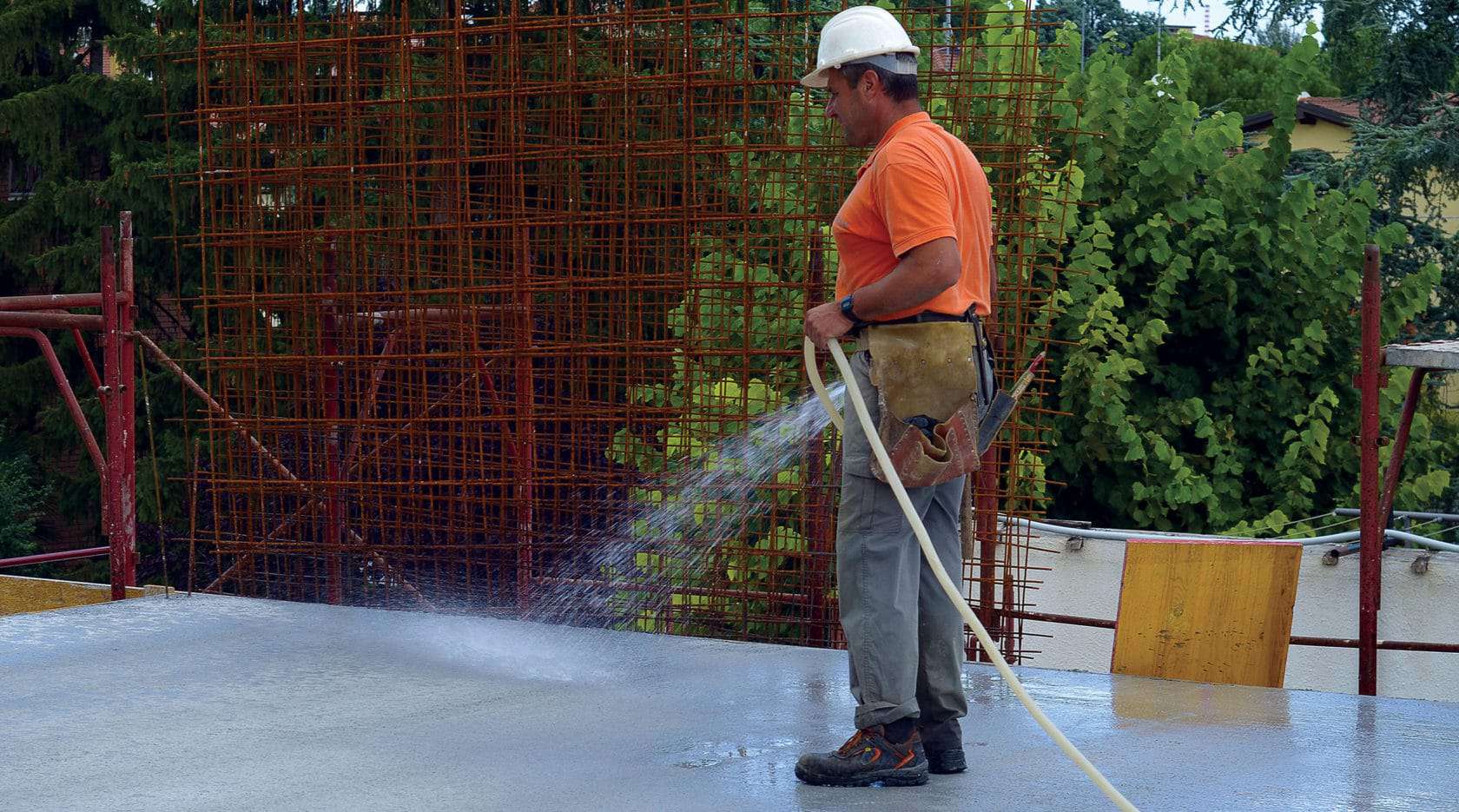 Water curing concrete slabs