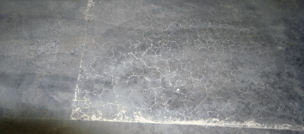 Concrete shrinkage cracking caused by poor curing hydration