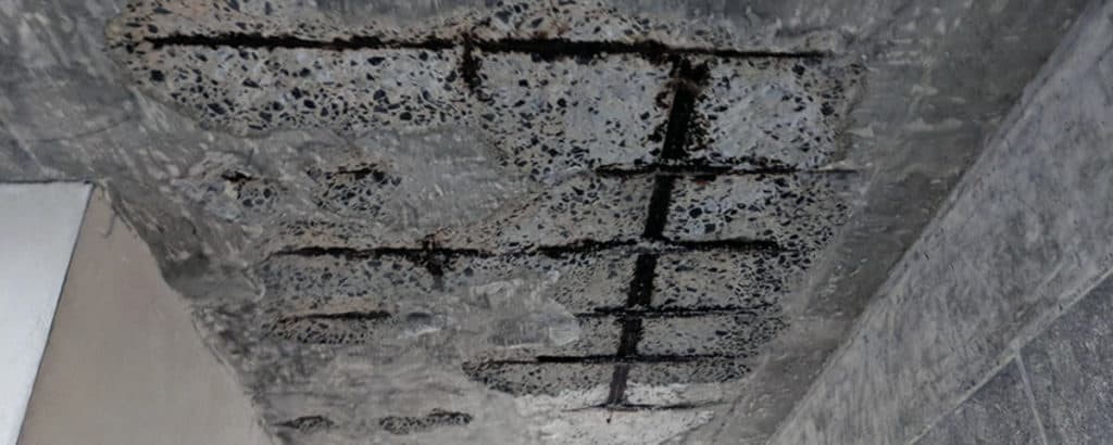 Deterioration of a concrete ceiling due to carbonation - photo courtesy Structural Guide