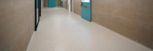 Aged care facility construction Hospital empty corridor Modern hospital automatic door entrance to the operating room vinyl floor coverings flooring