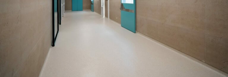 Aged care facility construction Hospital empty corridor Modern hospital automatic door entrance to the operating room vinyl floor coverings flooring