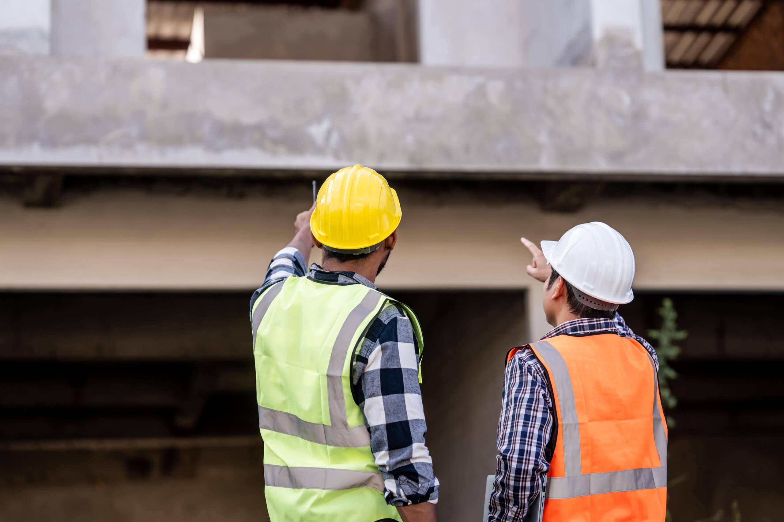 Structural engineers examine concrete building element
