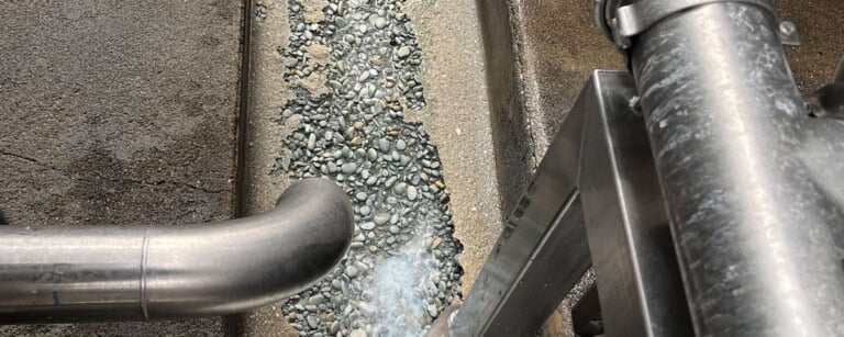 Acid attack on concrete drain in dairy production facility