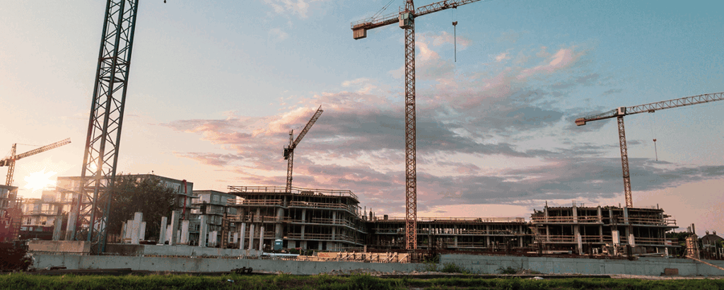 Construction site with multiple cranes operating - photo by Szabor Viktor on Unsplash