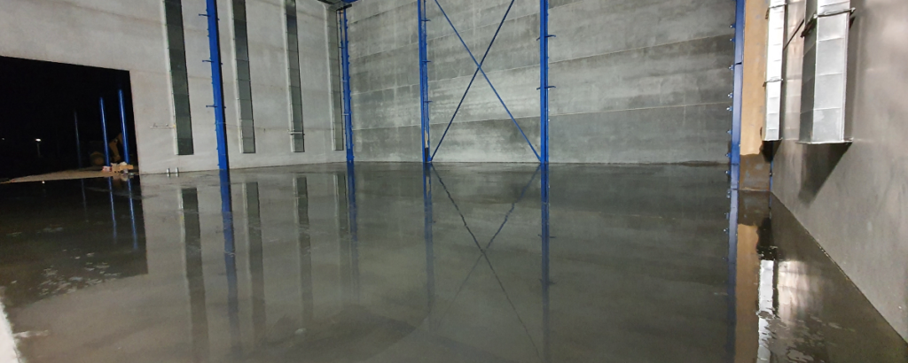 Reducing curing costs for warehouse floor slab concrete
