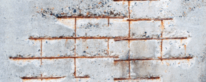 Concrete with low cover issues visible corroding reinforcement steel