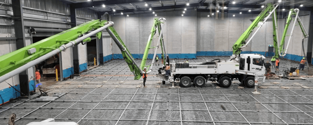Pumping concrete over extended lengths warehouse internal floor