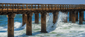 Concrete civil and marine infrastructure is subject to extreme challenges and needs protection