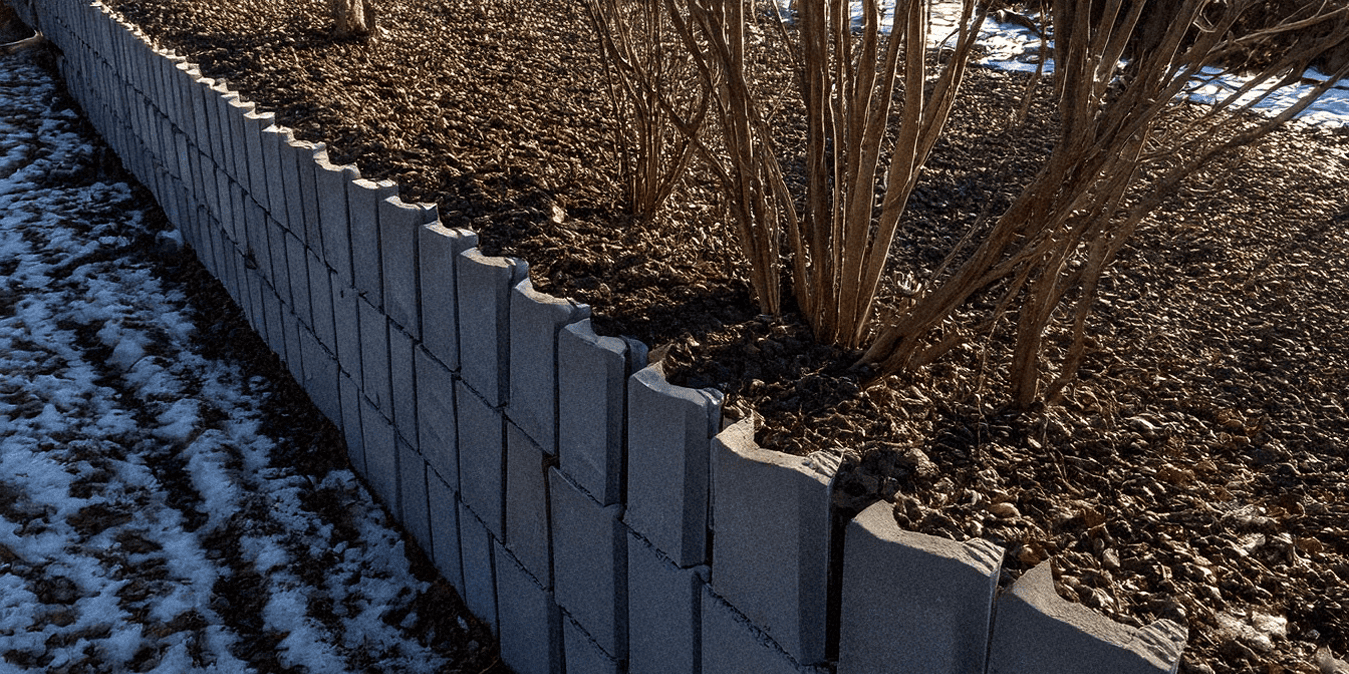 Concrete block landscape retaining wall winter freeze thaw protection CONQOR SHIELD